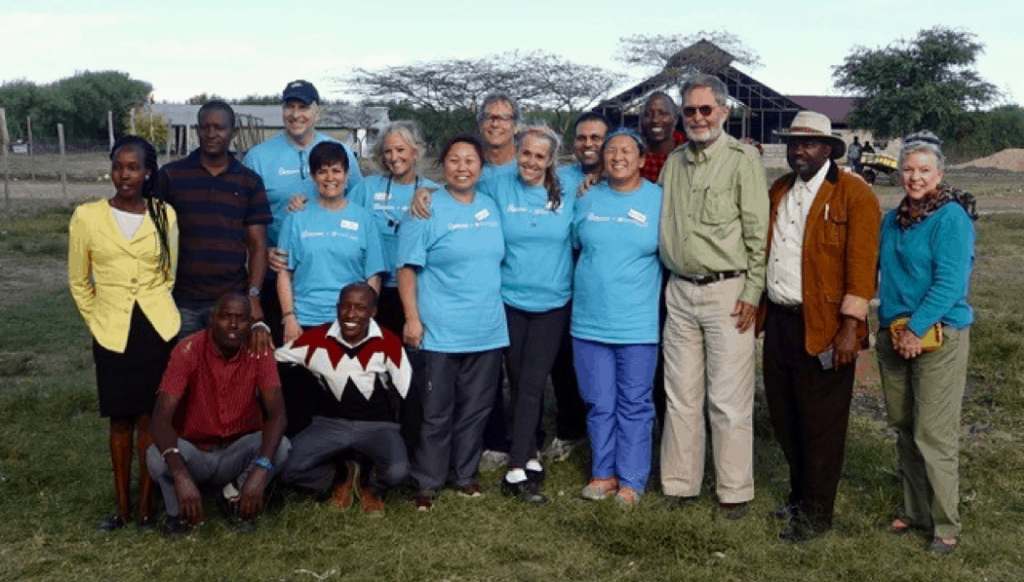 Hardwick Dental team in blue, with members of the Masai community and Basecamp Foundation.